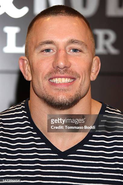 Professional fighter Georges St-Pierre signs copies of his new book "The Way Of The Fight" at Barnes & Noble bookstore at The Grove on April 23, 2013...