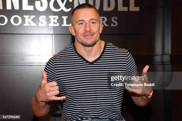 Professional fighter Georges St-Pierre signs copies of his new book "The Way Of The Fight" at Barnes & Noble bookstore at The Grove on April 23, 2013...