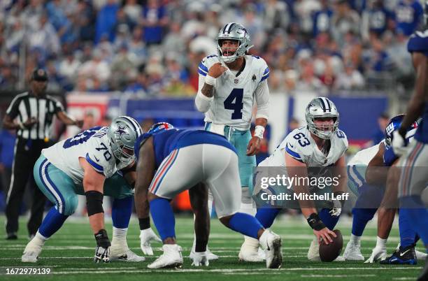 Dak Prescott of the Dallas Cowboys prepares to take a snap during the second quarter against the New York Giants at MetLife Stadium on September 10,...