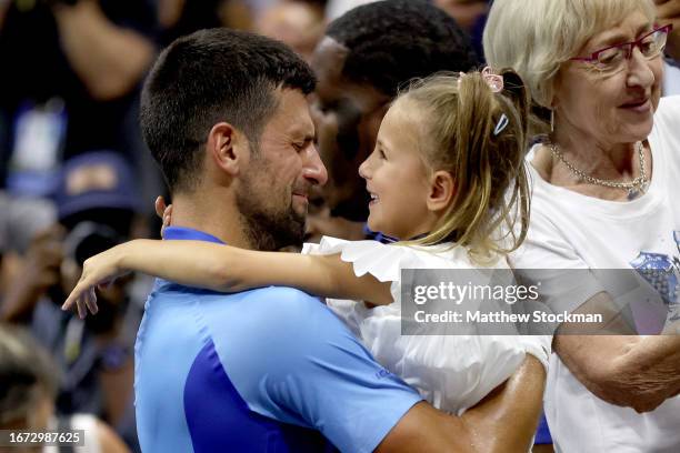 Novak Djokovic of Serbia celebrates with daughter Tara after defeating Daniil Medvedev of Russia during their Men's Singles Final match on Day...