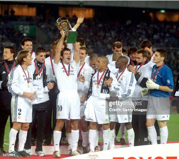 Luis Figo of Real Madrid lifts the trophy following victory in the Toyota Intercontinental Cup between Real Madrid and Olimpia, played at the...