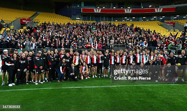 The Saints pose with fans after a St Kilda Saints AFL training session at Westpac Stadium on April 24, 2013 in Wellington, New Zealand. Sydney will...