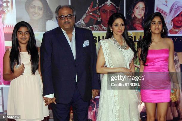 Indian Bollywood actress Sridevi with husband Boney Kapoor pose with their daughters Jhanvi and Kushi during a promotional event in Mumbai on April...