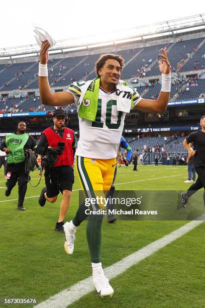 Jordan Love of the Green Bay Packers celebrates the 38-20 win against the Chicago Bears as he runs of the field at Soldier Field on September 10,...