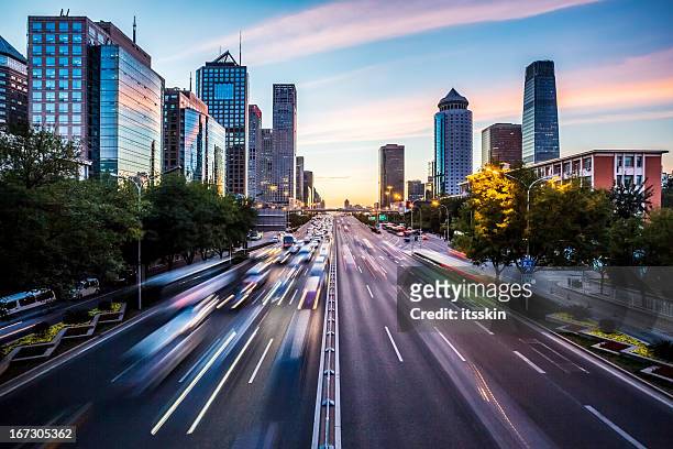 futuristic city at dusk - china east asia stock pictures, royalty-free photos & images