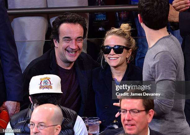 Olivier Sarkozy and Mary-Kate Olsen attend the Boston Celtics vs New York Knicks Playoff Game at Madison Square Garden on April 23, 2013 in New York...