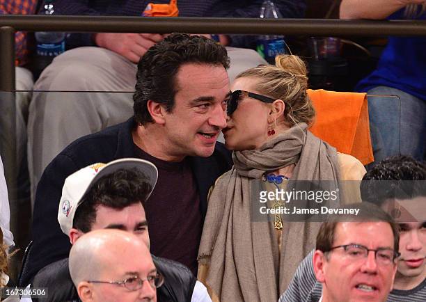 Olivier Sarkozy and Mary-Kate Olsen attend the Boston Celtics vs New York Knicks Playoff Game at Madison Square Garden on April 23, 2013 in New York...