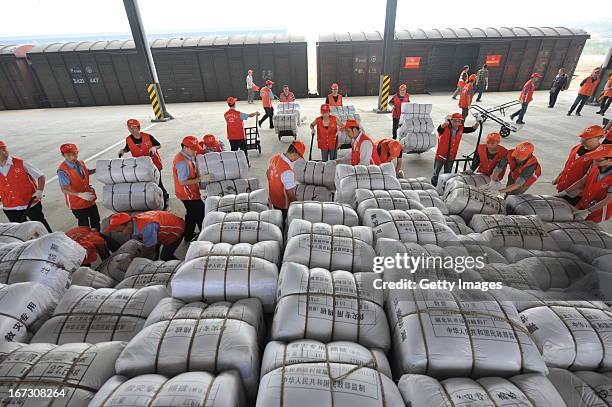 Rescuers unload relief supplies from a train at Xinjin railway station on April 23, 2013 in Xinjin County, China. A powerful earthquake struck the...