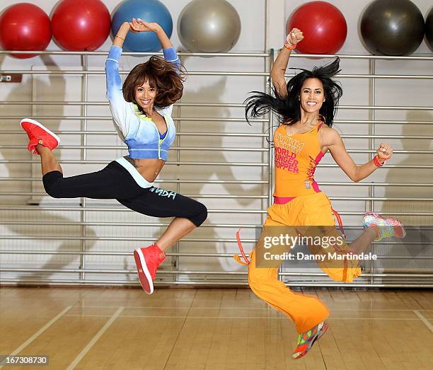 Jade Ewen and instructor Vicky Zagarra do zumba moves at a photocall to launch Zumba Fitness' Great Calorie Drive initiative at Columbo Centre on...