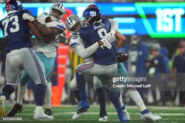 Chauncey Golston of the Dallas Cowboys sacks Daniel Jones of the New York Giants forcing a fumble during the fourth quarter at MetLife Stadium on...