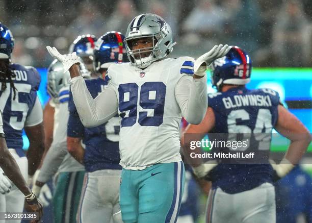 Chauncey Golston of the Dallas Cowboys reacts after a sack during the fourth quarter against the New York Giants at MetLife Stadium on September 10,...