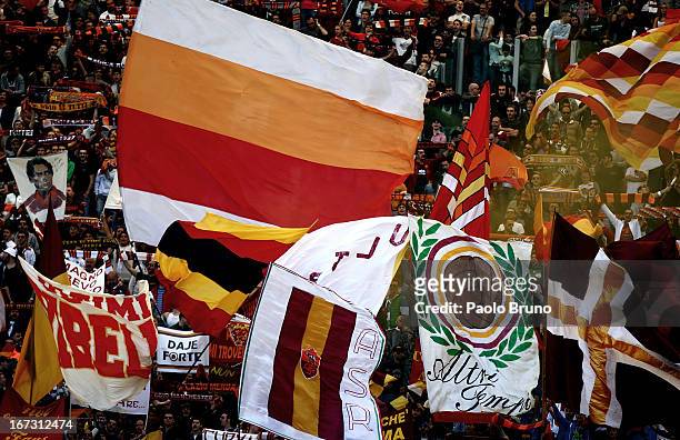 Roma fans with flags support their team during the Serie A match between AS Roma and Pescara at Stadio Olimpico on April 21, 2013 in Rome, Italy.