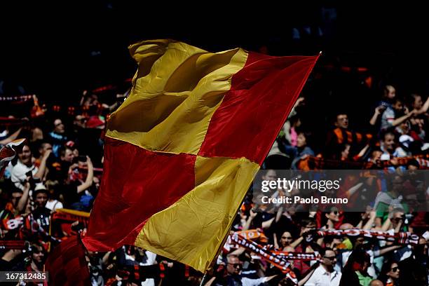 Roma fans with flags support their team during the Serie A match between AS Roma and Pescara at Stadio Olimpico on April 21, 2013 in Rome, Italy.