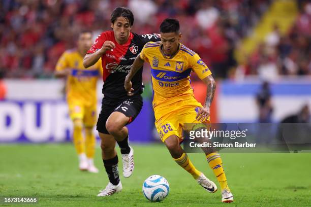 Raymundo Fulgencio of Tigres fights for the ball with Jose Abella of Atlas during the 8th round match between Atlas and Tigres UANL as part of the...