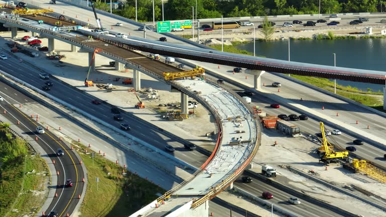 Freeway Construction Rendering Aerial view of busy american freeway road interchange under ...