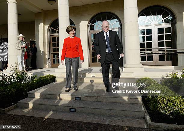Former first lady Laura Bush and Alan Lowe, director of the George W. Bush Presidential Library, arrive for a media availabilty during a tour of the...
