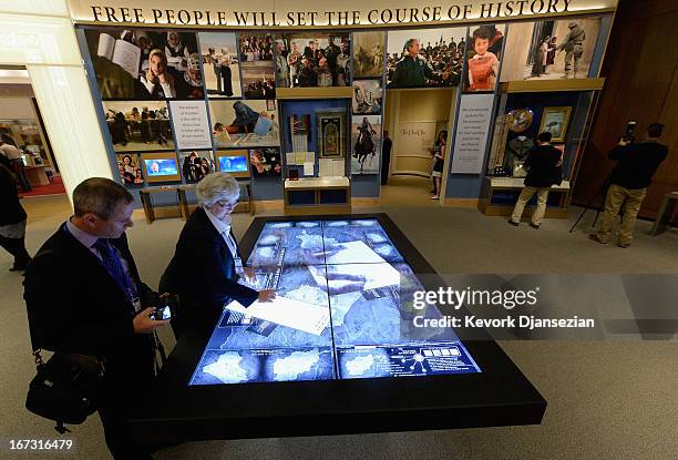 Docent Patricia Flynn shows off the interactive table of conflicts in the Middle East at the George W. Bush Presidential Center on the campus of...