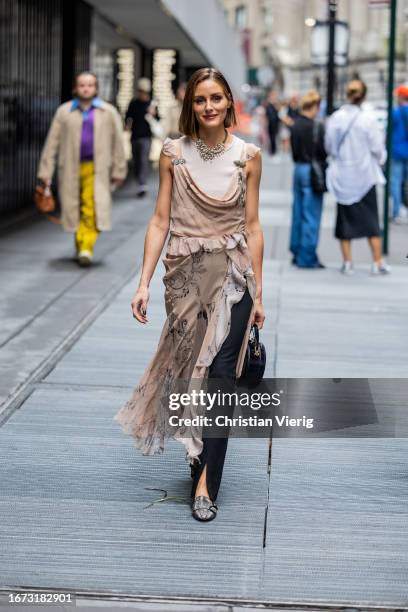 Olivia Palermo wears beige dress outside Jason Wu on September 10, 2023 in New York City.
