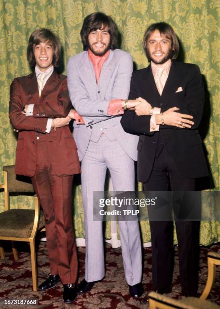 Robin Gibb , Barry Gibb and Maurice Gibb , of the musical trio the Bee Gee's, pose for a group portrait in London, England, August 21, 1970.