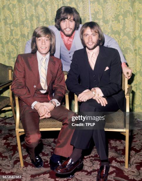 Robin Gibb , Barry Gibb and Maurice Gibb , of the musical trio the Bee Gee's, pose for a group portrait in London, England, August 21, 1970.
