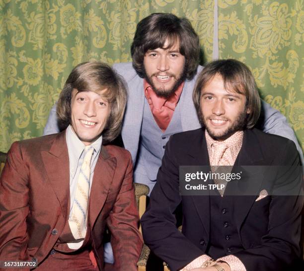 Robin Gibb , Barry Gibb and Maurice Gibb , of the musical trio the Bee Gee's, pose for a group portrait in London, England, August 21, 1970.