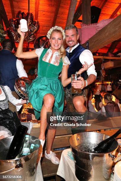Giulia Siegel and Ludwig Heer during the 25th Almauftrieb during the 188th Oktoberfest at Kaeferzelt on September 17 2023 in Munich, Germany.