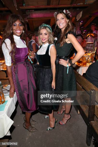 Nicole Coste, Kinga Mathe and Natalie Lefevre during the 25th Almauftrieb during the 188th Oktoberfest at Kaeferzelt on September 17 2023 in Munich,...