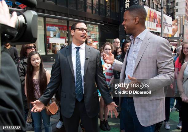 Calloway interviews AJ Clemente during a taping of "Extra" in Times Square on April 24, 2013 in New York City.