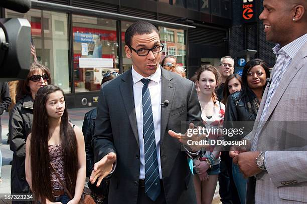 Calloway interviews AJ Clemente during a taping of "Extra" in Times Square on April 24, 2013 in New York City.