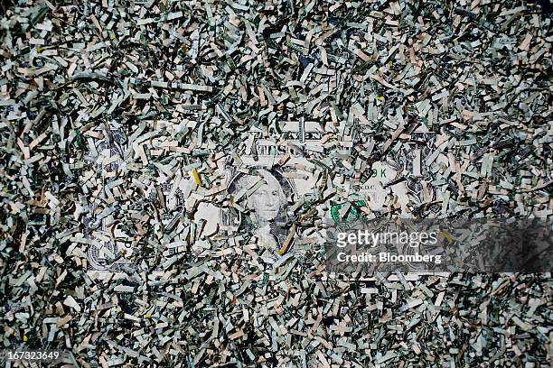 Shredded currency surrounds a U.S. One dollar bill in Washington, D.C., U.S., on Wednesday, April 24, 2013. The S&P 500 has surged 134 percent from a...
