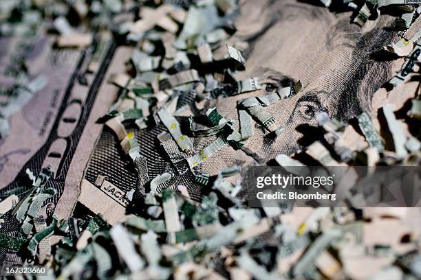 Shredded currency surrounds a U.S. Twenty dollar bill in Washington, D.C., U.S., on Wednesday, April 24, 2013. The S&P 500 has surged 134 percent...