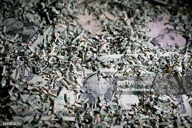 Shredded currency surrounds U.S. Dollar bills in Washington, D.C., U.S., on Wednesday, April 24, 2013. The S&P 500 has surged 134 percent from a...