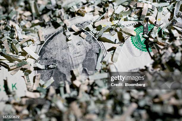 Shredded currency surrounds a U.S. One dollar bill in Washington, D.C., U.S., on Wednesday, April 24, 2013. The S&P 500 has surged 134 percent from a...