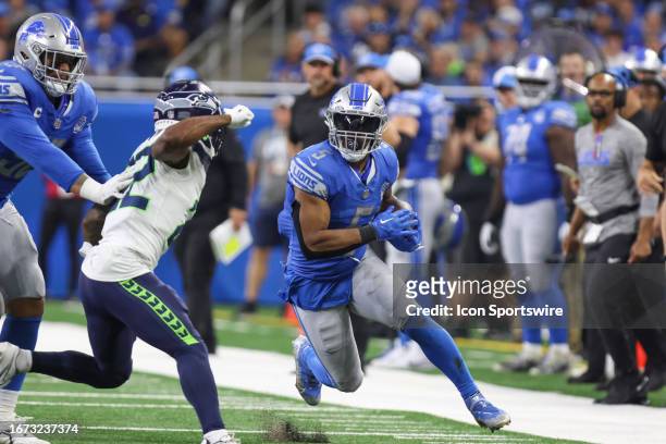 Detroit Lions running back David Montgomery runs with the ball during the third quarter of an NFL football game between the Seattle Seahawks and the...