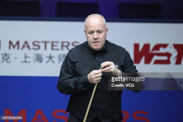 John Higgins of Scotland reacts in the first round match against Deng Haohui of China on day 1 of World Snooker Shanghai Masters 2023 at Shanghai...
