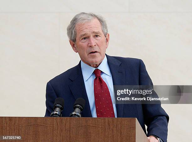 Former President George W. Bush participates in a signing ceremony inside the Freedom Hall for the joint use agreement between the National Archive...