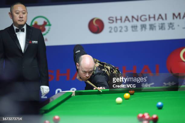 Gary Wilson of England plays a shot in the first round match against Fan Zhengyi of China on day 1 of World Snooker Shanghai Masters 2023 at Shanghai...