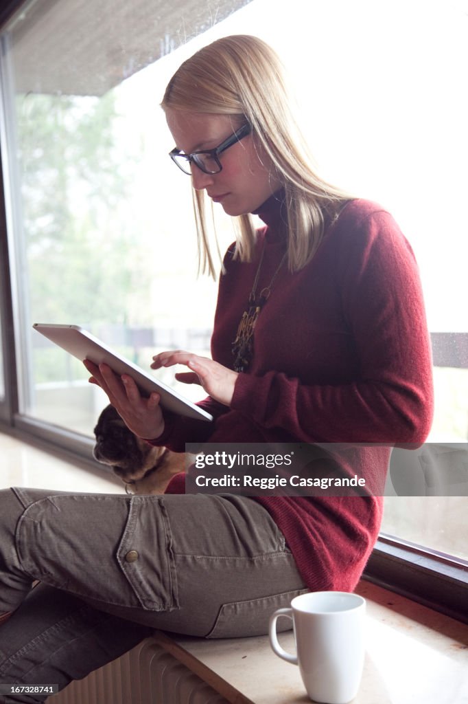 Blond girl using a tablet