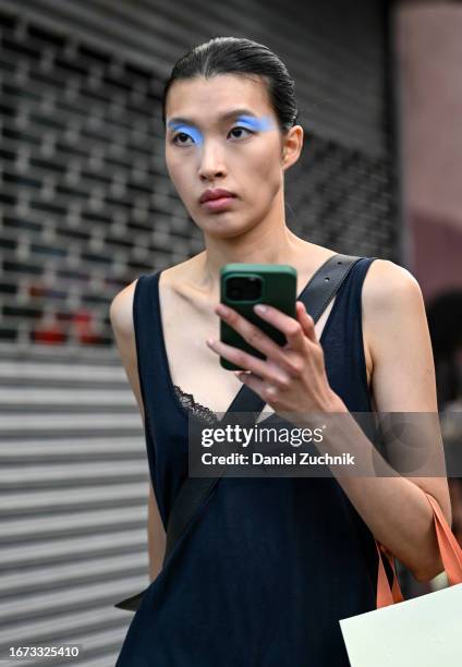 Model Dahan Phuong Oanh is seen wearing a blue top outside the 3.1 Phillip Lim show during NYFW S/S 2024 on September 10, 2023 in New York City.