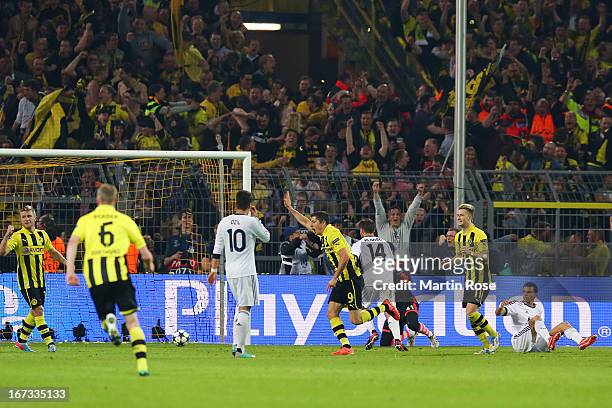 Robert Lewandowski of Borussia Dortmund turns to celebrate after scoring their third goal during the UEFA Champions League semi final first leg match...