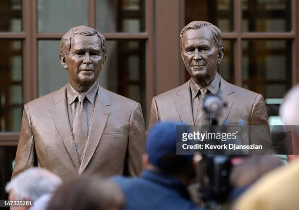 Statues of former Presidents George W. Bush and his father George H.W. Bush are on display during a tour of the George W. Bush Presidential Center on...