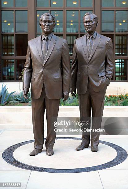 Statues of former Presidents George W. Bush and his father George H.W. Bush are on display during a tour of the George W. Bush Presidential Center on...