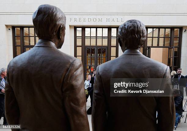 Bronze statues of former Presidents George W. Bush and his father George H.W. Bush are on display during a tour of the George W. Bush Presidential...