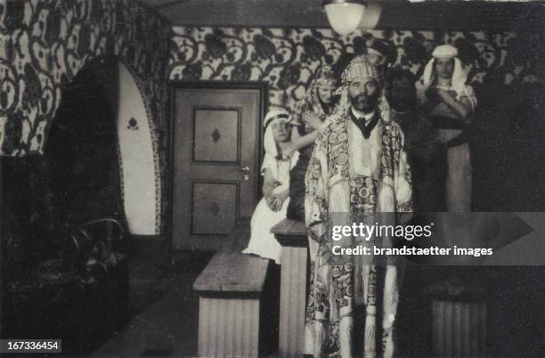 Gustav Klimt as an attendand of an party in the Primavesi-house, with a house-coat designed by Carl Otto Czeschka, Name of the pattern: "Waldidyll"....