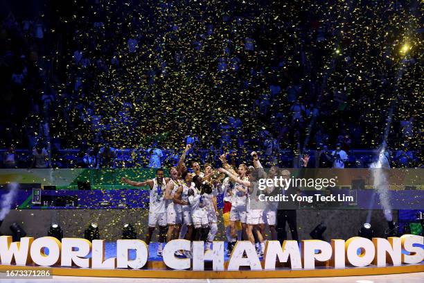 Dennis Schroder of Germany lifts the Naismith Trophy as he celebrates with teammates after the FIBA Basketball World Cup Final victory over Serbia at...