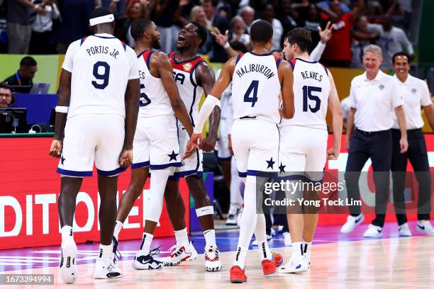 Mikal Bridges of the United States celebrates with Bobby Portis , Anthony Edwards , Tyrese Haliburton and Austin Reaves after scoring a three-pointer...