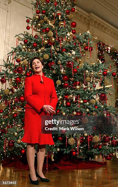 First lady Laura Bush shows off some of the Christmas decorations in the East Room of the White House during a media preview December 5, 2002 in...