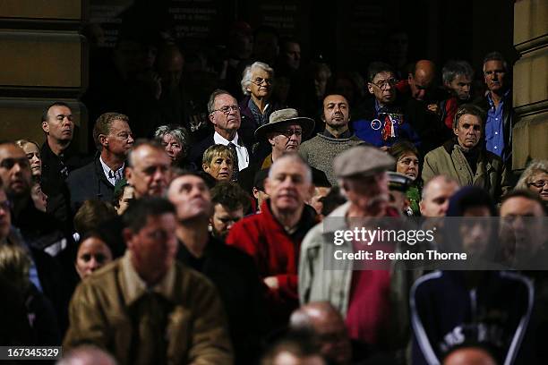 People gather around the ANZAC Cenotaph during the ANZAC Dawn Service at the Martin Place Cenotaph on April 25, 2013 in Sydney, Australia. Veterans,...