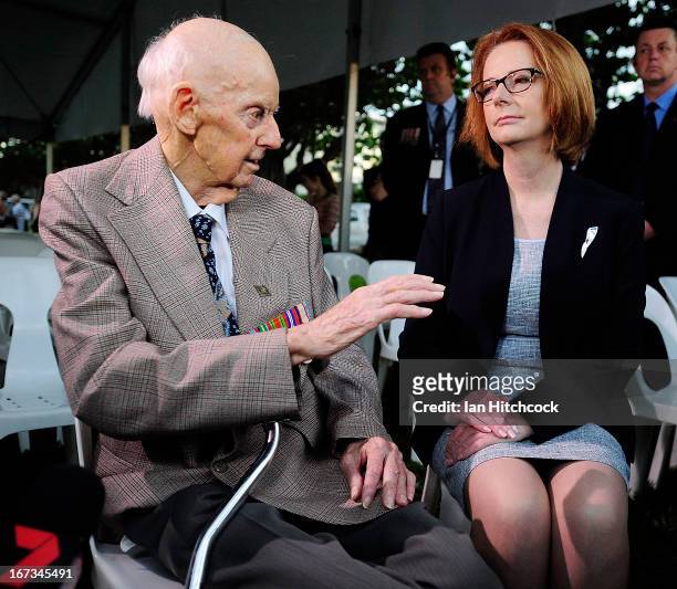 Prime Minister of Australia julia Gillard talks with former P.O.W Sidney King at the dawn service on April 25, 2013 in Townsville, Australia....