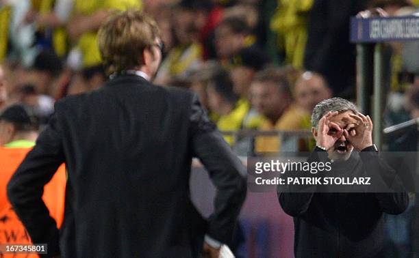 Dortmund's head coach Juergen Klopp looks on as Real Madrid's Portuguese coach Jose Mourinho gestures during the UEFA Champions League semi final...